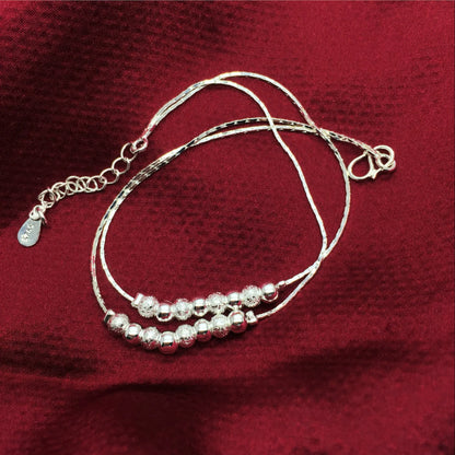 Bracelet de cheville fines boules argentées estampillées