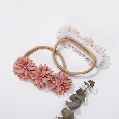 Entzückende Blumenstirnbänder für Babys