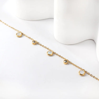 Damenarmband aus vergoldetem Edelstahl mit weißer Muschel und Zirkonia