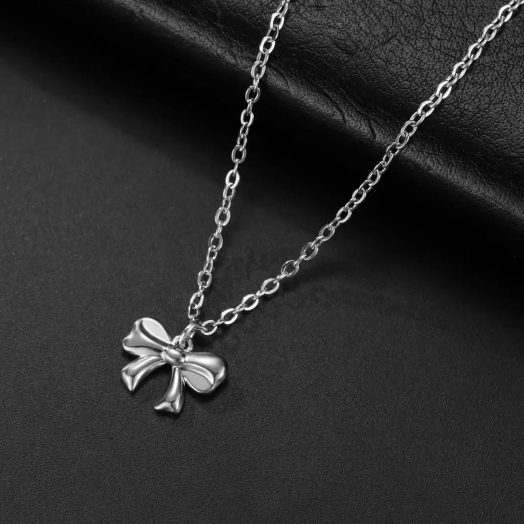 Collier pendentif nœud papillon en acier inoxydable pour femme