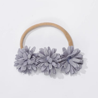 Entzückende Blumenstirnbänder für Babys