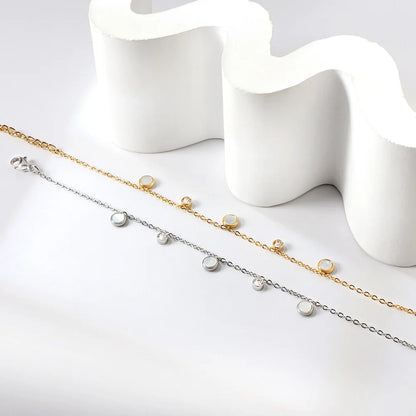 Damenarmband aus vergoldetem Edelstahl mit weißer Muschel und Zirkonia