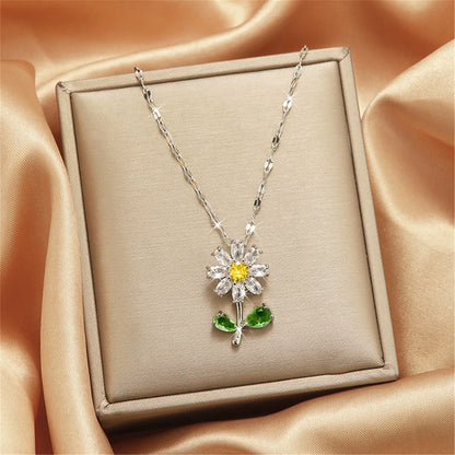 Collier en or avec pendentif fleur, zircone incrustée, chaîne en acier titane et pendentif soleil en opale (1 pièce).