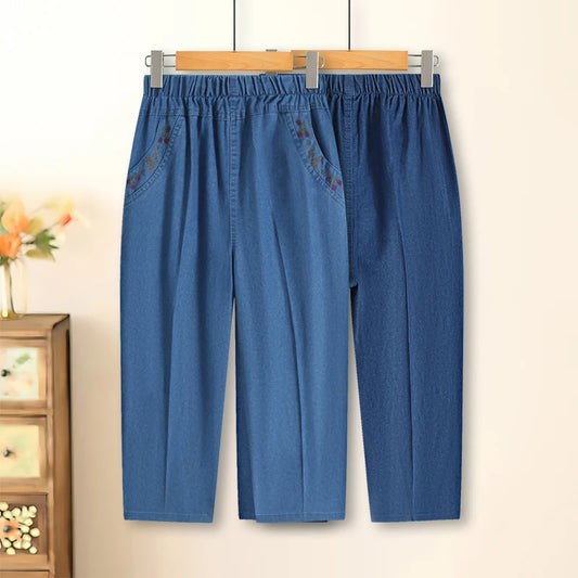 Hohe Taille, blaue gerade Stickerei-Taschen-Damenhose