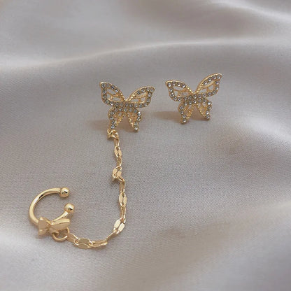 Boucle d'oreille pour femme avec chaîne en métal papillon